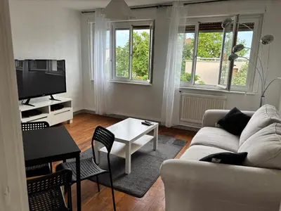 Coin salon dans l'établissement Appartement des merveilles