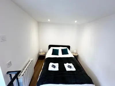 Un ou plusieurs lits dans un hébergement de l'établissement Place SAINT PAUL triplex 19m2