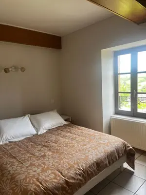 Un ou plusieurs lits dans un hébergement de l'établissement Le Balcon Beaujolais