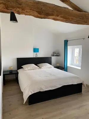 Un ou plusieurs lits dans un hébergement de l'établissement Le Gîte d'Antoine - Beaujolais
