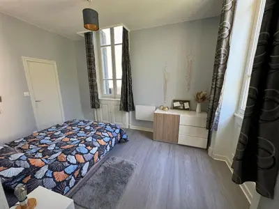 Un ou plusieurs lits dans un hébergement de l'établissement Appartement dans le Beaujolais