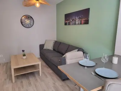 Coin salon dans l'établissement Rénové, calme, Parking gratuit