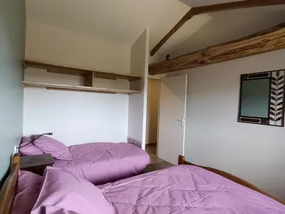 Un ou plusieurs lits dans un hébergement de l'établissement Gîte du Bobet