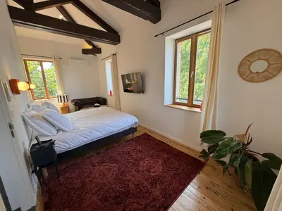 Un ou plusieurs lits dans un hébergement de l'établissement Les Chambres d'Hôtes du Château Eclosion