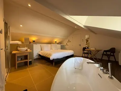 Un ou plusieurs lits dans un hébergement de l'établissement Les Chambres d'Hôtes du Château Eclosion