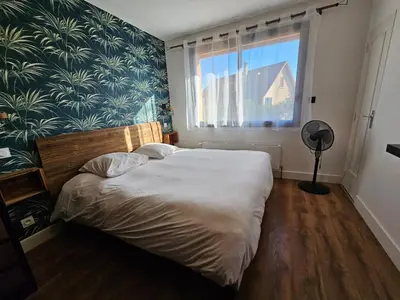 Un ou plusieurs lits dans un hébergement de l'établissement 4 chambres - 200m2 - Parking - Jardin