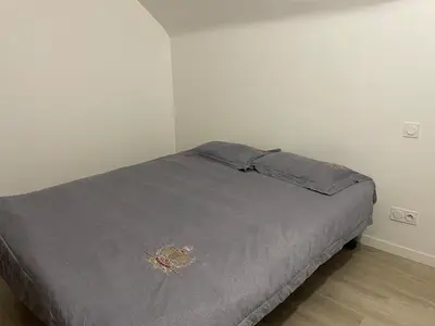 Un ou plusieurs lits dans un hébergement de l'établissement Un charmant appartement bien équipé