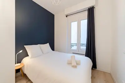 Un ou plusieurs lits dans un hébergement de l'établissement Cozy T2 near Part-Dieu 4 people Lafayette District