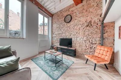 Coin salon dans l'établissement Le Pouteau charme authentique 2 chambres