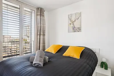 Un ou plusieurs lits dans un hébergement de l'établissement Magnifique appartement 70m2 Confluence - Vue panoramique avec Parking Privé