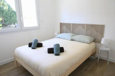 Un ou plusieurs lits dans un hébergement de l'établissement Superbe appartement T2