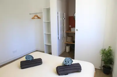 Un ou plusieurs lits dans un hébergement de l'établissement Superbe appartement T2
