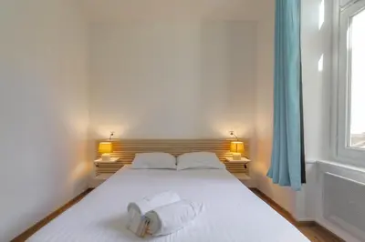 Un ou plusieurs lits dans un hébergement de l'établissement Superbe appartement sur la Presqu'île - Lyon