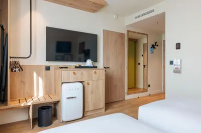 Un ou plusieurs lits dans un hébergement de l'établissement Hampton By Hilton Lyon Airport