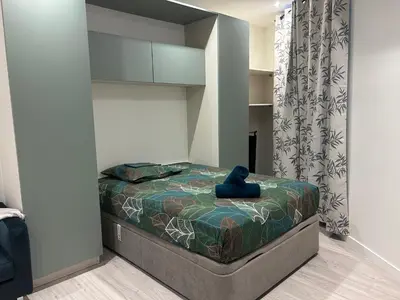 Un ou plusieurs lits dans un hébergement de l'établissement Studio indépendant climatisé à Lyon 8