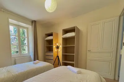 Un ou plusieurs lits dans un hébergement de l'établissement Le Ciné-Club - Appartement signature