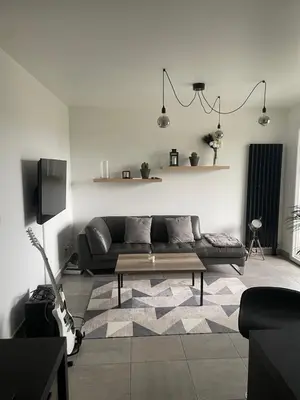 Coin salon dans l'établissement Bienvenue, charmant lieu cosy