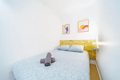 Un ou plusieurs lits dans un hébergement de l'établissement Studio cozy au coeur de lyon 8