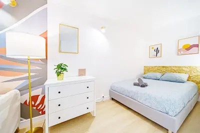 Un ou plusieurs lits dans un hébergement de l'établissement Studio cozy au coeur de lyon 8