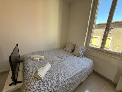 Un ou plusieurs lits dans un hébergement de l'établissement Studio Lune New & Cozy - Centre Vénissieux