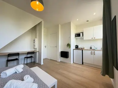 Cuisine ou kitchenette dans l'établissement Studio L'émeraude NEW Cozy - Gare Parilly