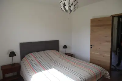 Un ou plusieurs lits dans un hébergement de l'établissement Belle Maison, calme avec parking