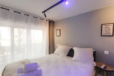 Un ou plusieurs lits dans un hébergement de l'établissement Cosy et Charmant duplex Brotteaux - Masséna