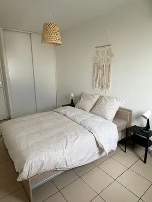 Un ou plusieurs lits dans un hébergement de l'établissement Appartement T3