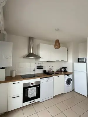 Cuisine ou kitchenette dans l'établissement Appartement T3