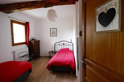 Un ou plusieurs lits dans un hébergement de l'établissement Maison d'Hôtes des 2 Chênes