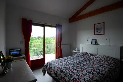 Un ou plusieurs lits dans un hébergement de l'établissement Maison d'Hôtes des 2 Chênes
