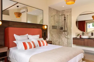 Un ou plusieurs lits dans un hébergement de l'établissement Hausman Suites - Appart Hotel