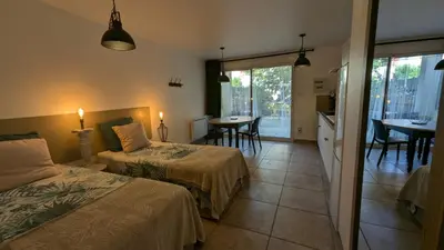 Un ou plusieurs lits dans un hébergement de l'établissement Studihôtel Le COSY