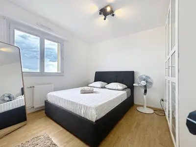 Un ou plusieurs lits dans un hébergement de l'établissement Grand T3, balcon et garage - Venissieux Lyon Sud