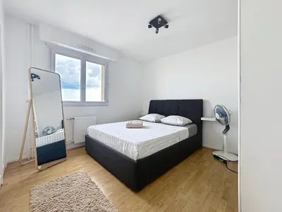 Un ou plusieurs lits dans un hébergement de l'établissement Grand T3, balcon et garage - Venissieux Lyon Sud