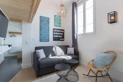 Coin salon dans l'établissement Belfort- Duplex