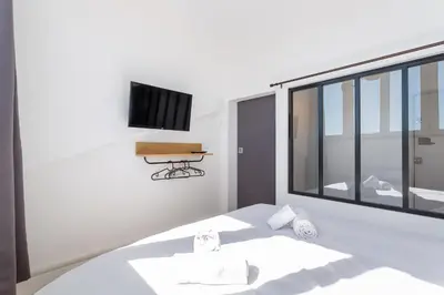Un ou plusieurs lits dans un hébergement de l'établissement Belfort- Duplex