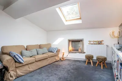 Coin salon dans l'établissement Le Cerf - House with view and swimming pool