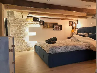 Un ou plusieurs lits dans un hébergement de l'établissement Appartement de Christopher
