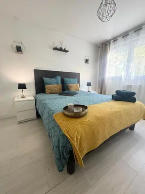 Un ou plusieurs lits dans un hébergement de l'établissement Studio Le Cocon 22m2
