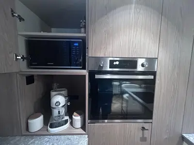 Cuisine ou kitchenette dans l'établissement La Demi Lune
