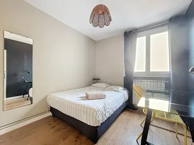 Un ou plusieurs lits dans un hébergement de l'établissement Le Cosy Genin - 3 Chambres Bureaux Parking
