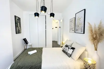 Un ou plusieurs lits dans un hébergement de l'établissement Songoria - Appartement 4 personnes - check in h24 & wifi