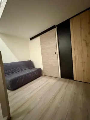 Un ou plusieurs lits dans un hébergement de l'établissement Maisonnette au milieu de vignes