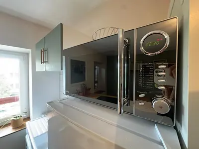 Cuisine ou kitchenette dans l'établissement T2 chaleureux au coeur des vignes -vue place de Condrieu-long séjour possible