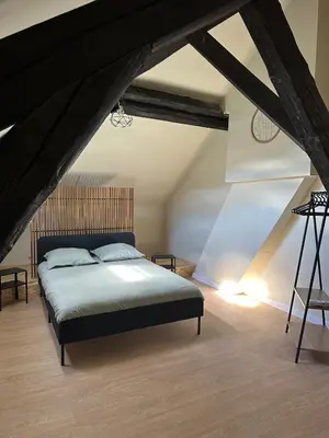 Un ou plusieurs lits dans un hébergement de l'établissement Appartement cosy gare chateaucreux