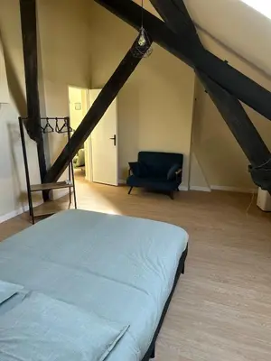 Un ou plusieurs lits dans un hébergement de l'établissement Appartement cosy gare chateaucreux
