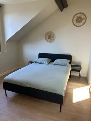 Un ou plusieurs lits dans un hébergement de l'établissement Appartement 2 chambres gare chateaucreux