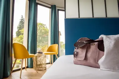 Un ou plusieurs lits dans un hébergement de l'établissement LOVEROOM & SPA &René