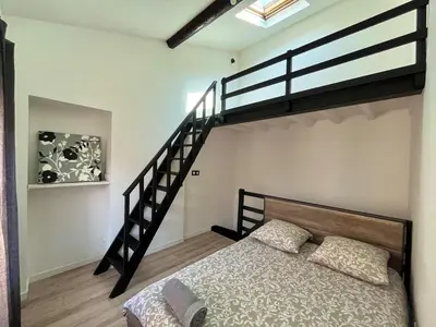 Un ou plusieurs lits dans un hébergement de l'établissement Duplex avec terrasse à 15 min de Lyon